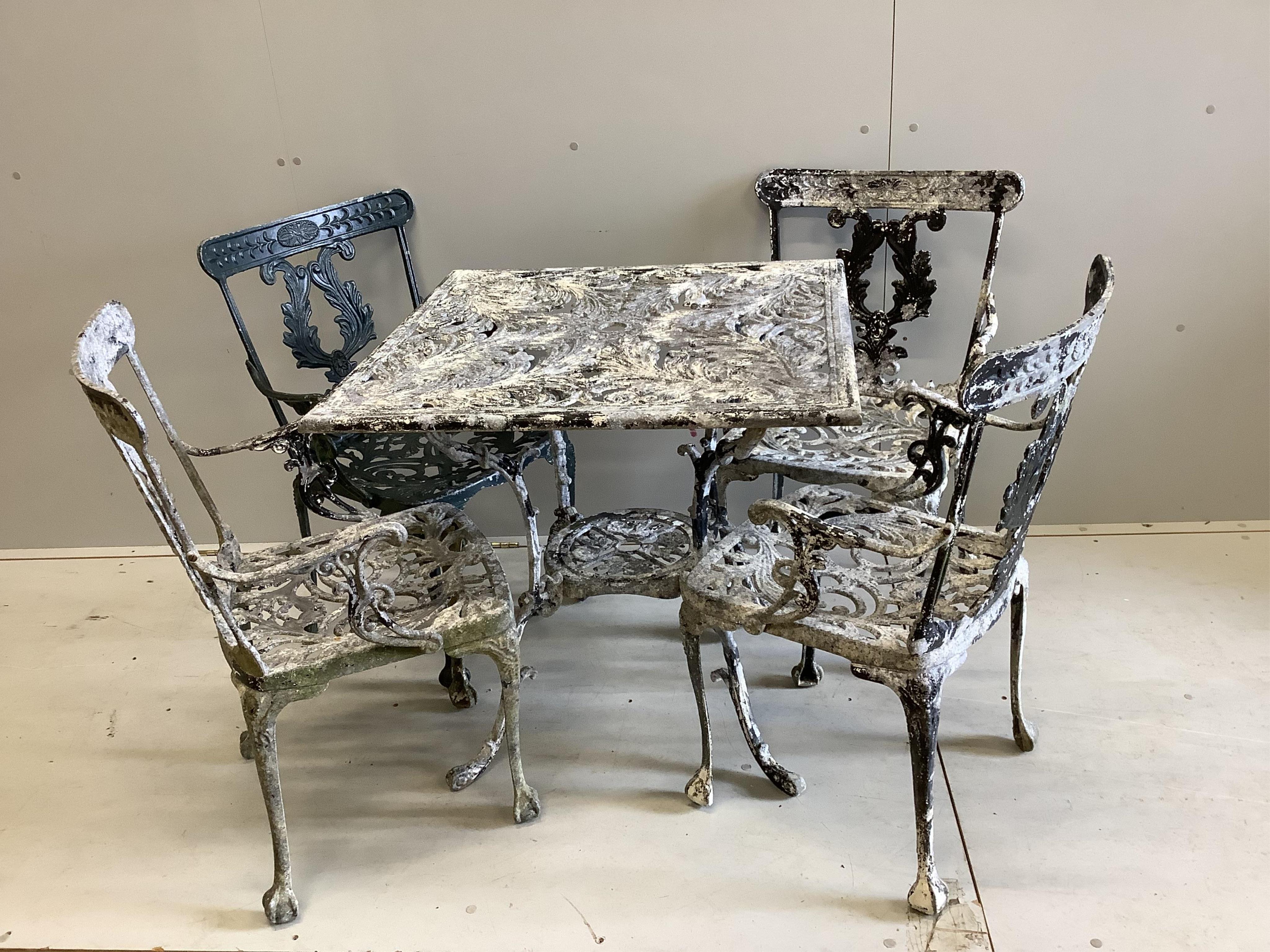 A five piece black painted aluminium garden table and four chairs. Condition - poor